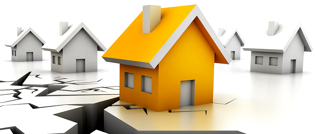 割れる地面に立つ家のイラスト